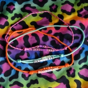Trzy adresówki paracord Bueno DOG z imieniem FIGA w kolorach różowym, miętowym i pomarańczowym